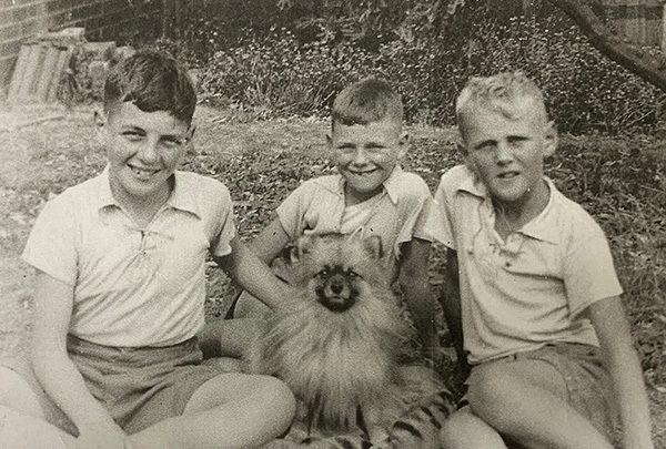 Alan, Ian and Peter Dunne, with pet dog Tony